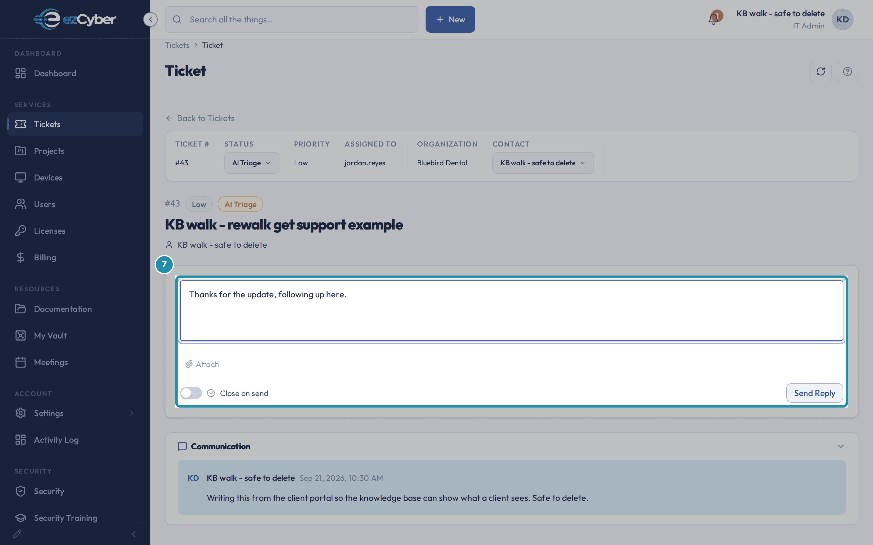 The ticket's reply box with a typed reply called out, with Attach below it and Send Reply to the right.
