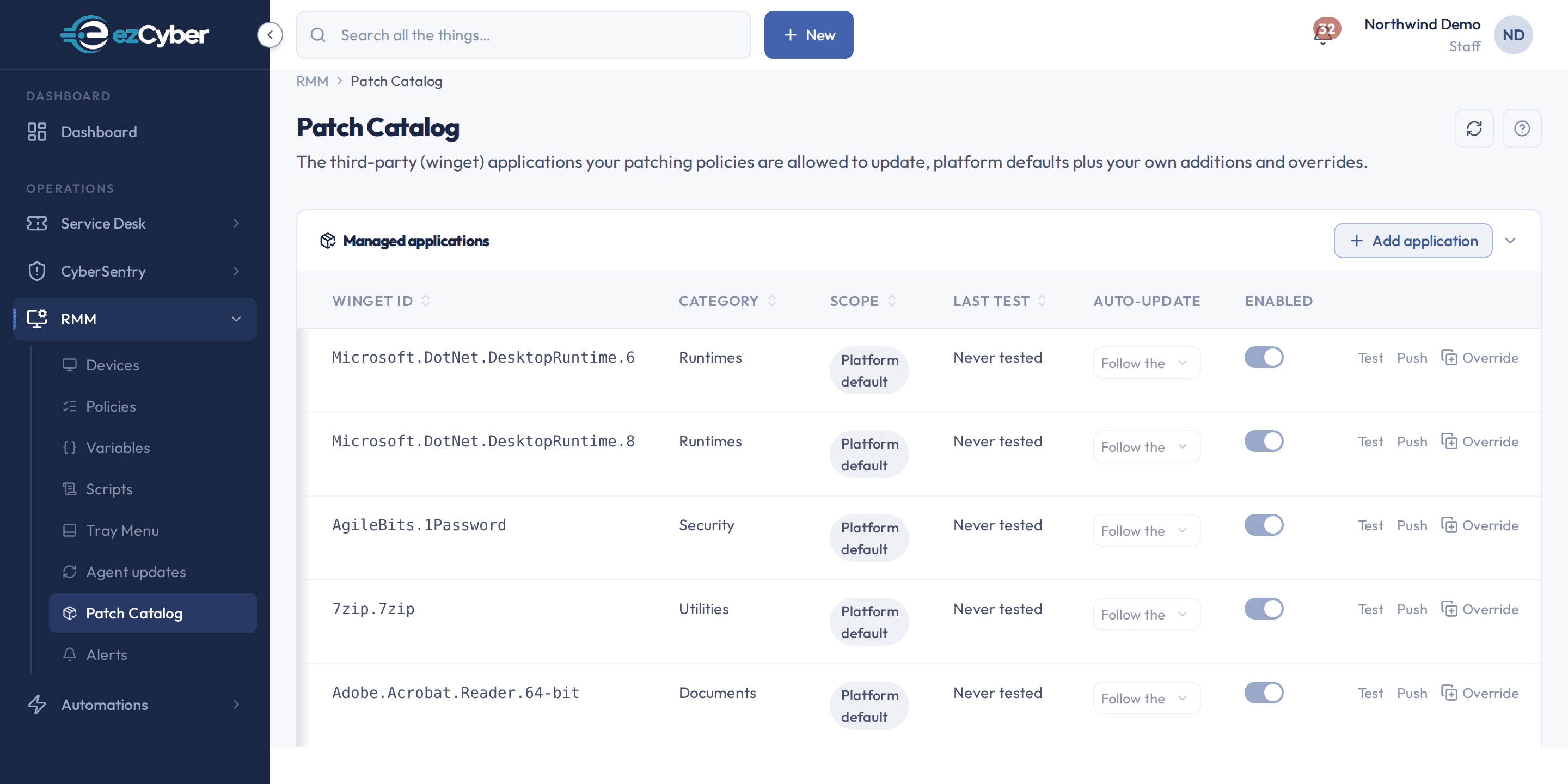The ezCyber patch catalog: third-party applications the agent is allowed to update, each with its winget id, category, scope and enabled state